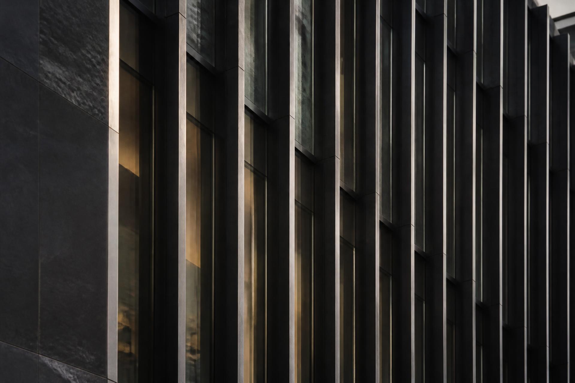 Detail of a modern institutional building facade at dusk